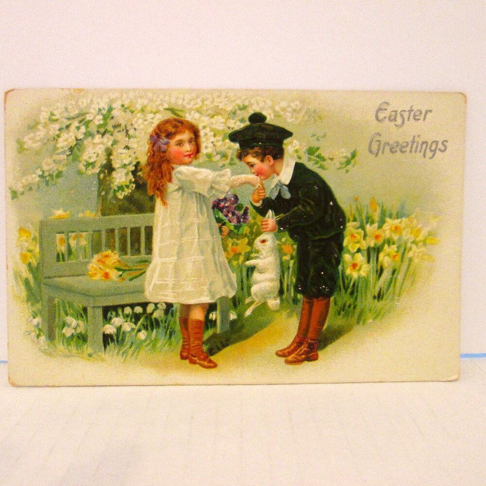Antq Easter postcard of a young man kissing a little girls's hand